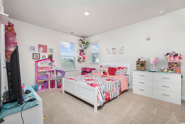 bedroom with light carpet