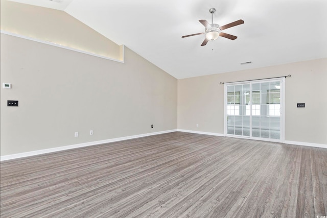 spare room featuring hardwood / wood-style flooring, ceiling fan, and lofted ceiling