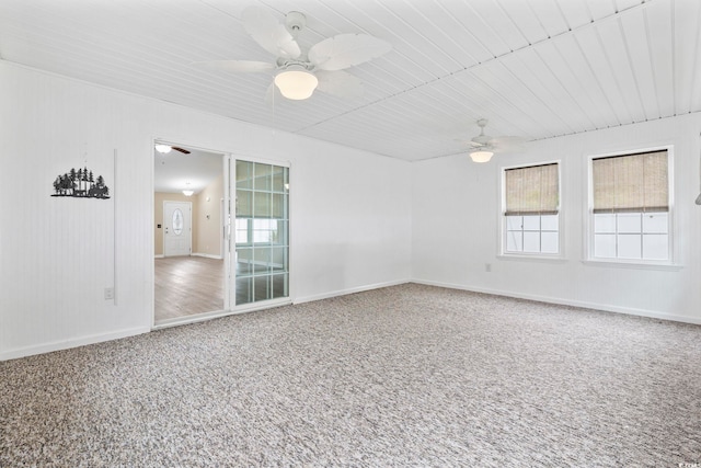 spare room with carpet floors and ceiling fan