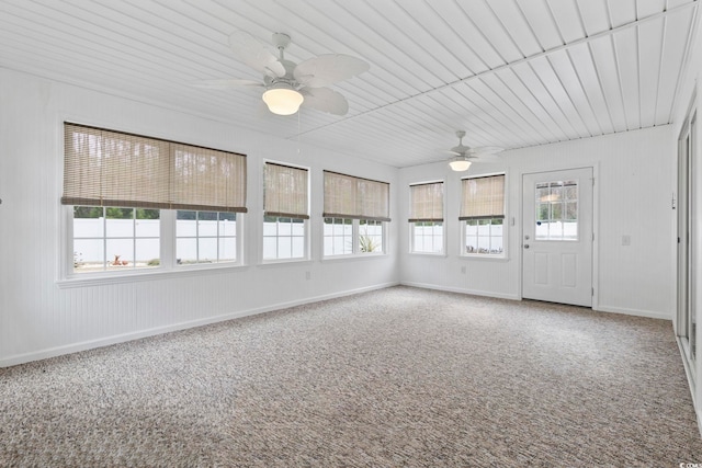 unfurnished sunroom with ceiling fan