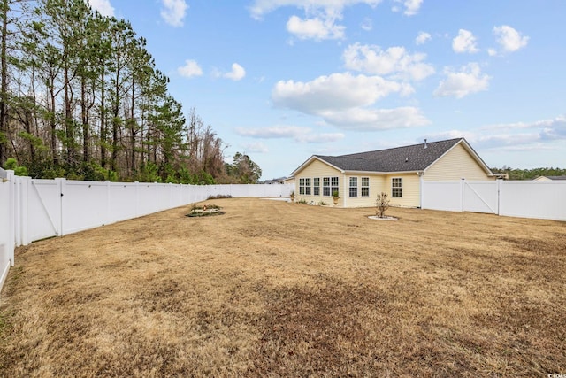 back of house featuring a yard