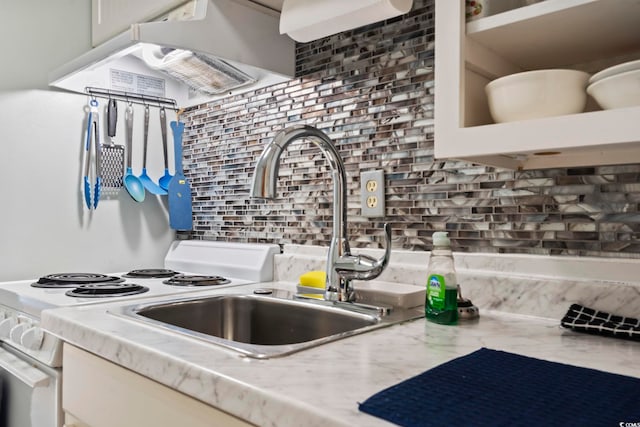 kitchen featuring light stone countertops and backsplash