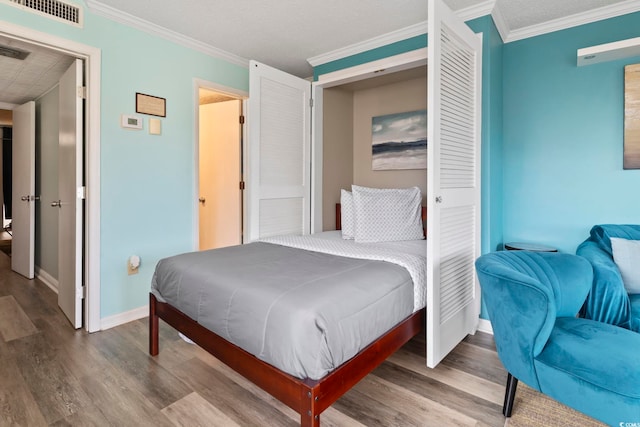 bedroom featuring wood-type flooring and ornamental molding