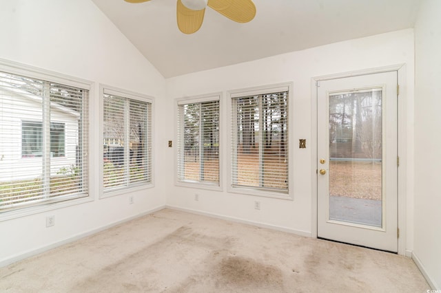 unfurnished sunroom featuring vaulted ceiling and ceiling fan