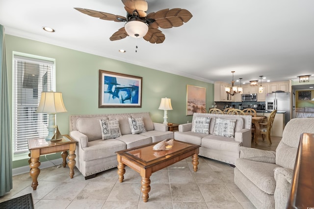 living room featuring ceiling fan with notable chandelier, ornamental molding, and light tile patterned floors