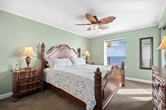 carpeted bedroom with ceiling fan and ornamental molding