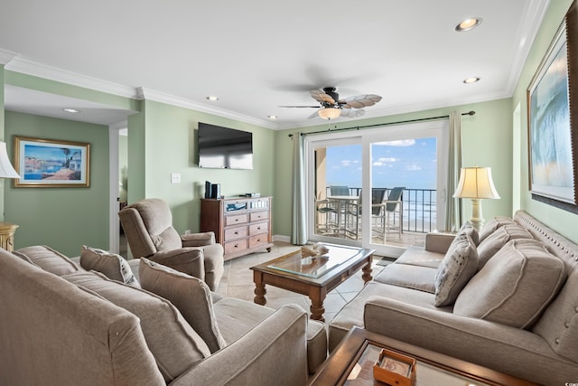 living room with ceiling fan, ornamental molding, and light tile patterned floors