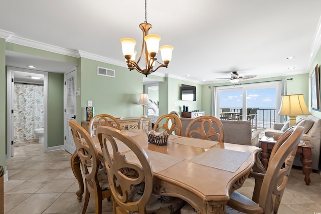 tiled dining room featuring ceiling fan with notable chandelier and ornamental molding