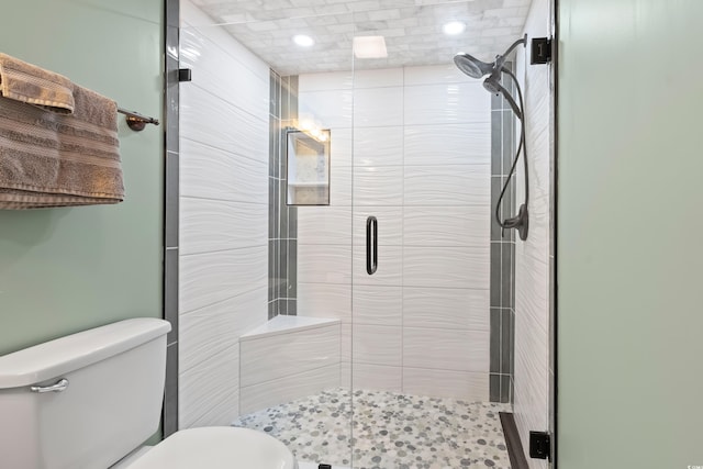 bathroom featuring toilet and walk in shower