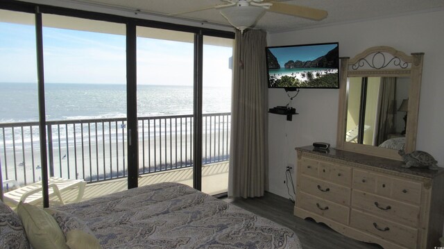 4719 S Ocean Blvd Unit 609, North Myrtle Beach, SC 29582 - bedroom featuring access to outside and wood finished floors