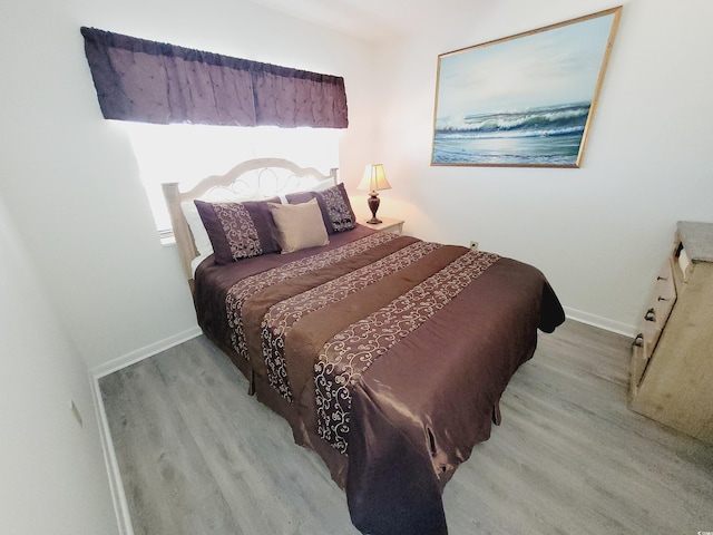 bedroom with light hardwood / wood-style flooring