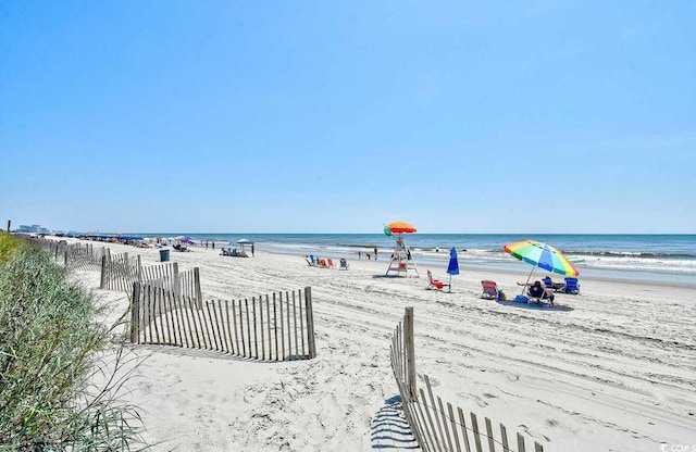 4719 S Ocean Blvd Unit 609, North Myrtle Beach, SC 29582 - water view with nearby beach and fence