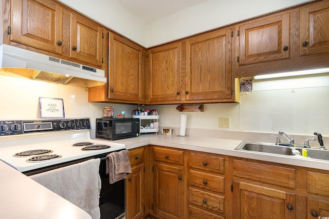 kitchen featuring white electric range and sink