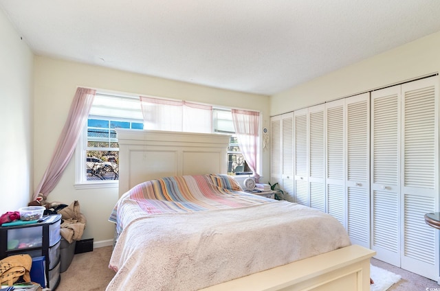 carpeted bedroom featuring a closet