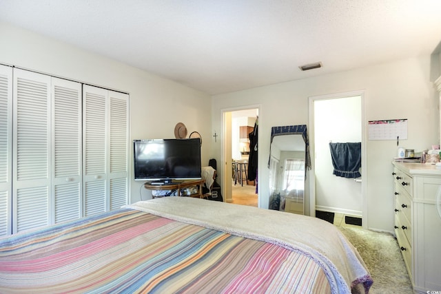 carpeted bedroom with a closet