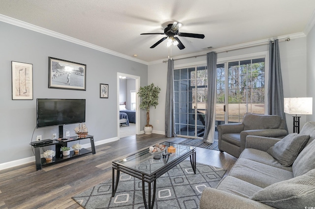 living room with ceiling fan, dark wood-type flooring, and ornamental molding