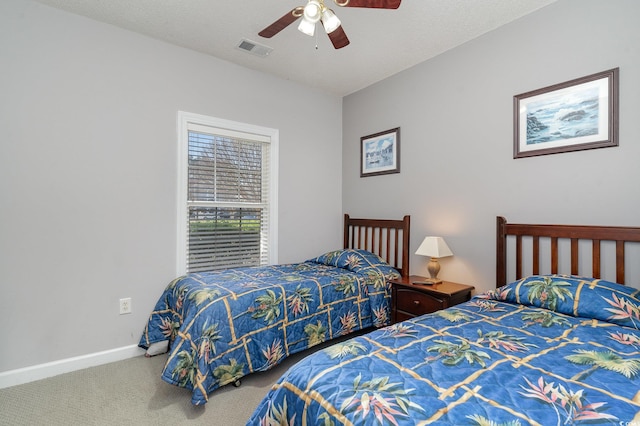 bedroom with ceiling fan and carpet floors