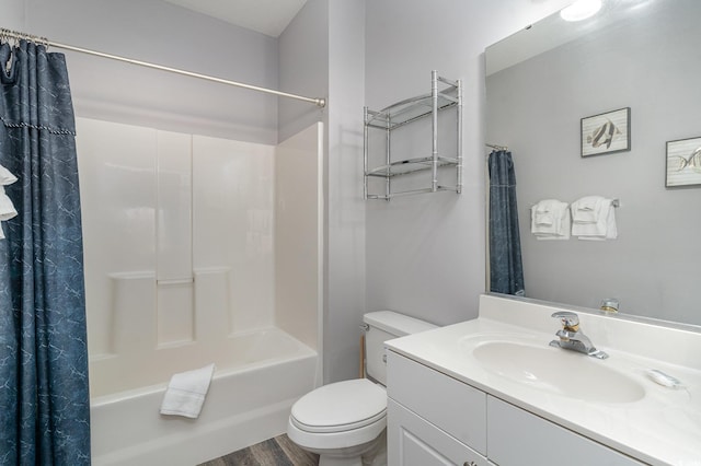 full bathroom featuring shower / bath combo with shower curtain, toilet, wood-type flooring, and vanity