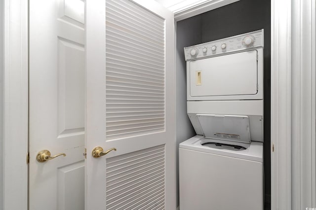 washroom with stacked washer and clothes dryer