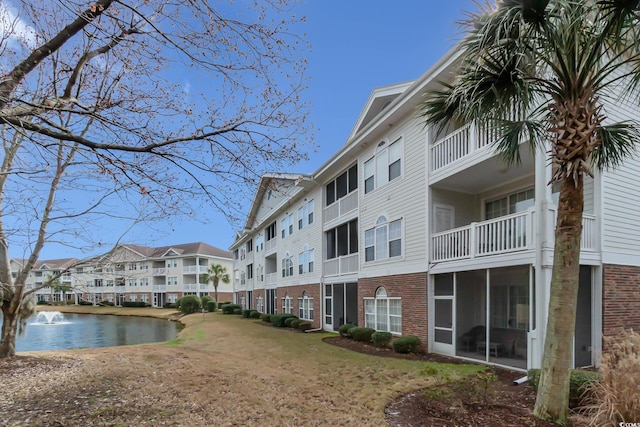 view of building exterior with a water view