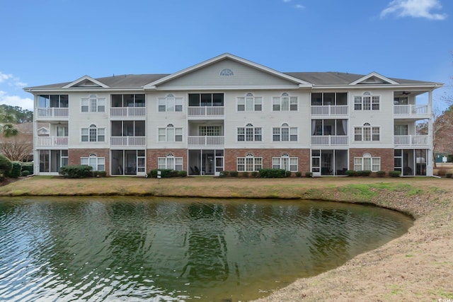 view of building exterior with a water view