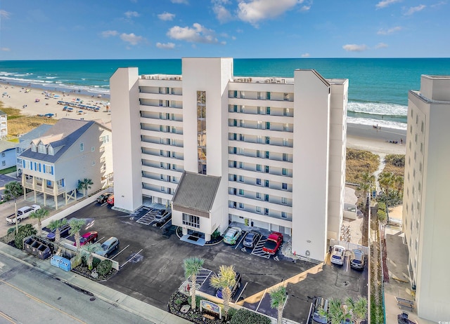 bird's eye view with a water view and a view of the beach