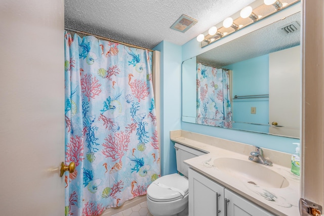 bathroom featuring tile patterned floors, walk in shower, vanity, a textured ceiling, and toilet