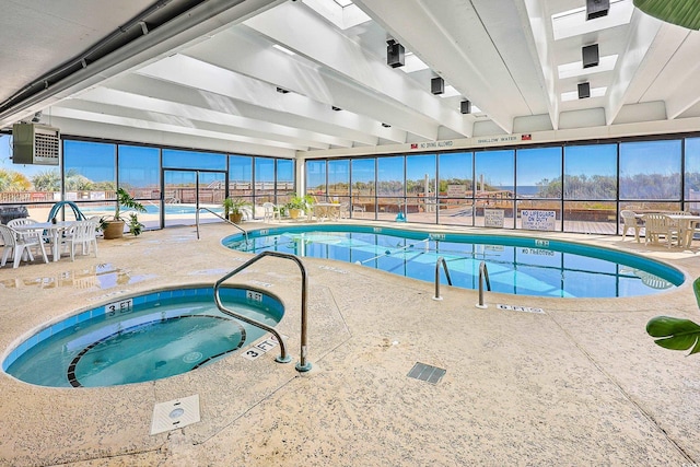 view of pool with a skylight