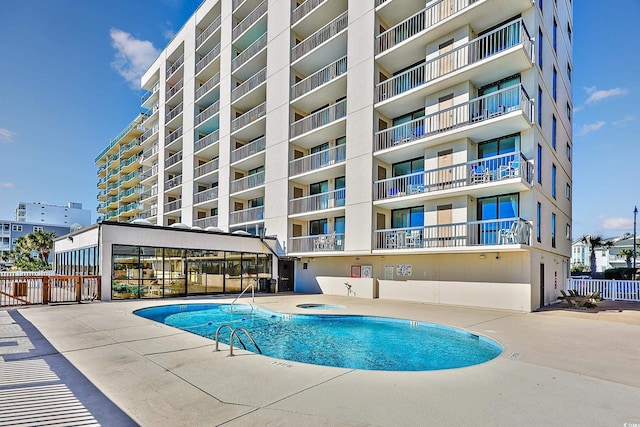 view of swimming pool with a patio