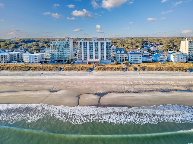 bird's eye view with a water view and a view of the beach