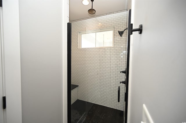 bathroom with a shower stall