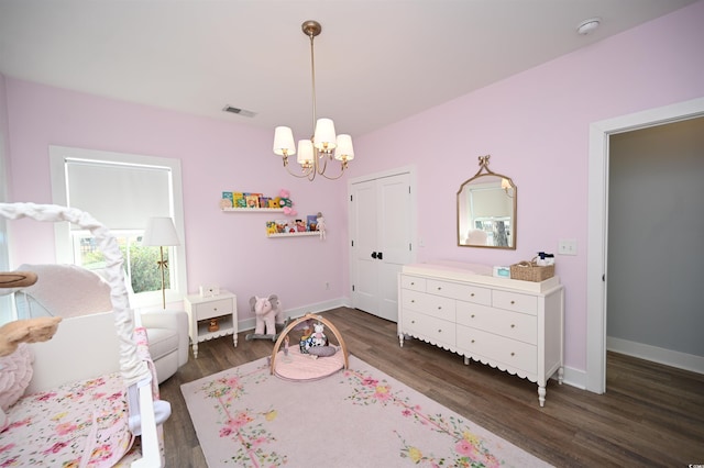 bedroom with dark wood finished floors, baseboards, a chandelier, and visible vents