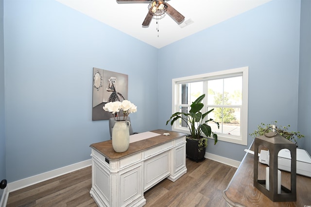 office with ceiling fan, visible vents, baseboards, and dark wood-style flooring