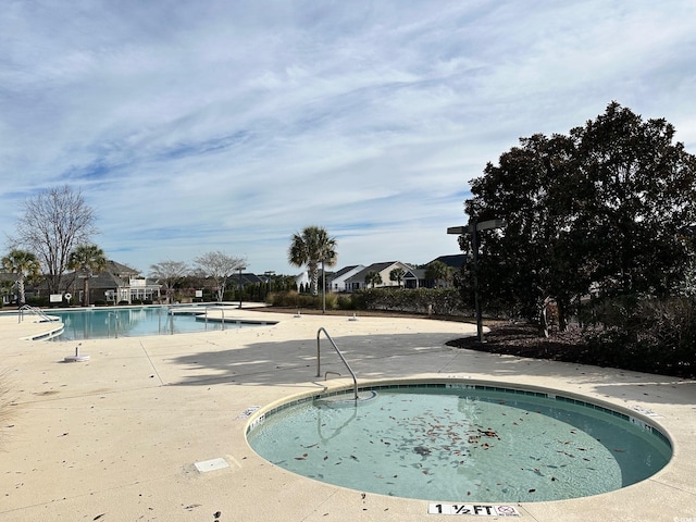 view of swimming pool featuring a patio