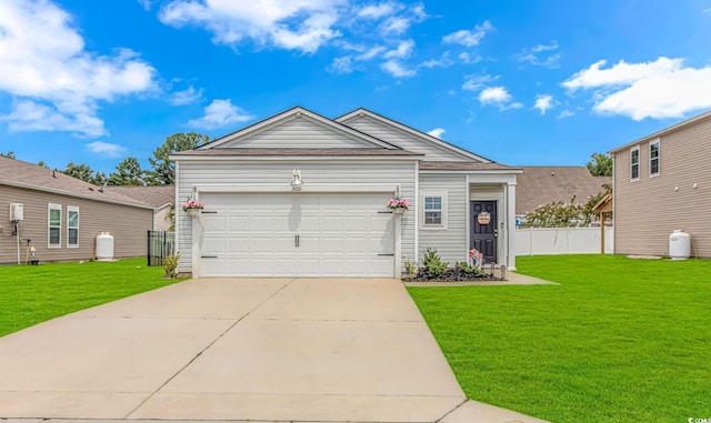 view of front of home featuring a front yard and a garage