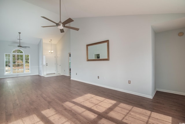 unfurnished living room featuring wood-type flooring, high vaulted ceiling, and an inviting chandelier