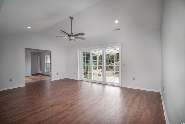 spare room with dark hardwood / wood-style flooring, vaulted ceiling, and ceiling fan