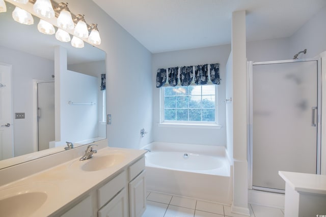 bathroom featuring plus walk in shower, vanity, and tile patterned floors