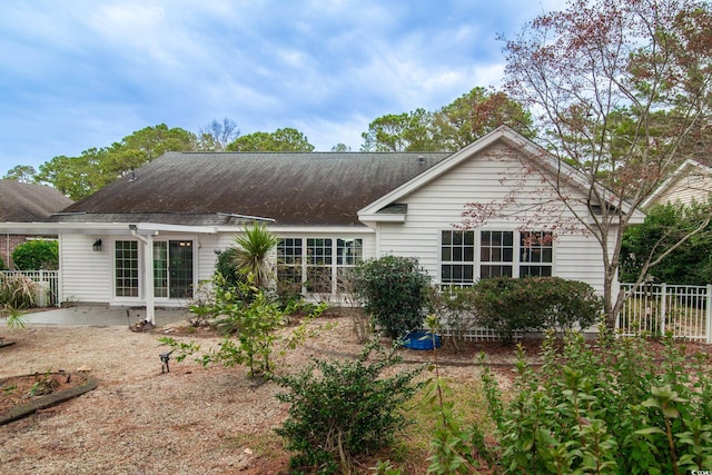 rear view of house featuring a patio