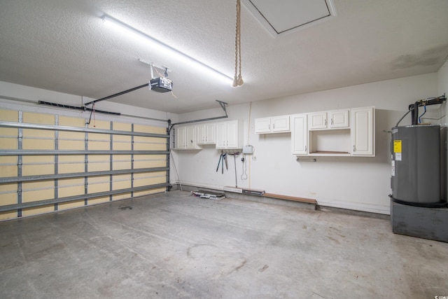 garage featuring electric water heater and a garage door opener