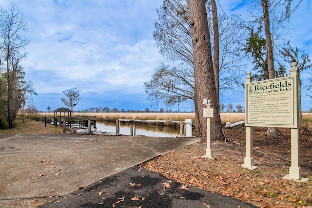 view of community with a water view