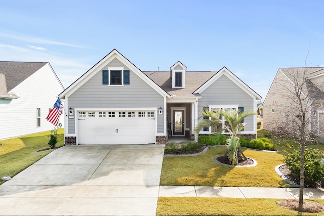 6550 Anterselva Dr, Myrtle Beach, SC 29572 - view of front facade with concrete driveway, a front lawn, brick siding, and an attached garage