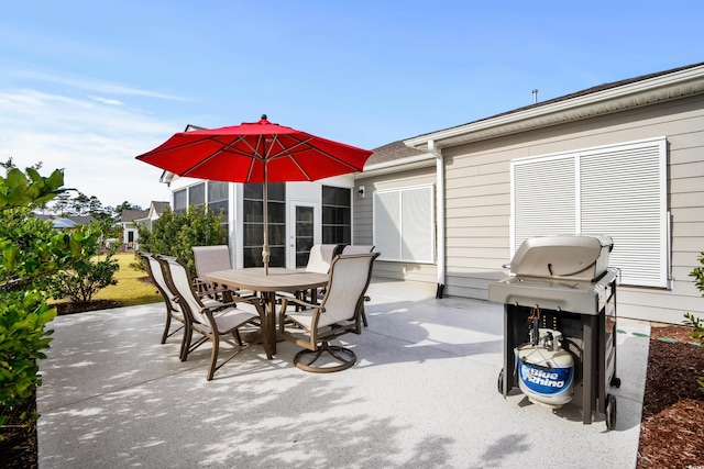 view of patio / terrace featuring area for grilling and outdoor dining space