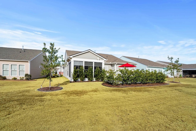 6550 Anterselva Dr, Myrtle Beach, SC 29572 - back of house with a lawn