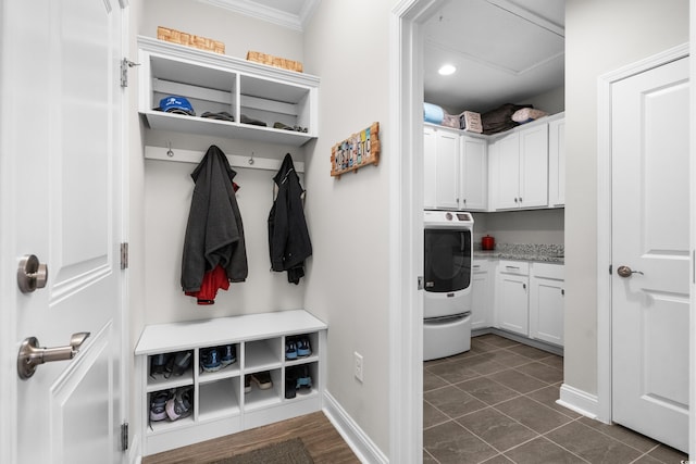 mudroom with washer / dryer, baseboards, ornamental molding, and dark tile patterned flooring