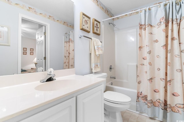 full bathroom featuring vanity, toilet, shower / bathtub combination with curtain, and a textured ceiling