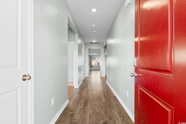 corridor with dark wood-type flooring