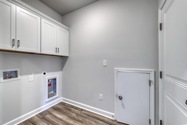 clothes washing area with washer hookup, dark hardwood / wood-style flooring, cabinets, and hookup for an electric dryer