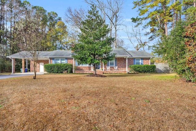 ranch-style house with a front yard and a garage