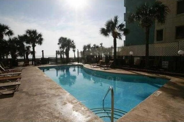 view of swimming pool featuring a patio